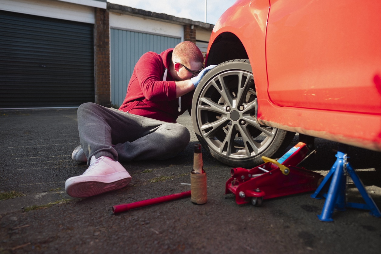 mechanic checking brake fluid