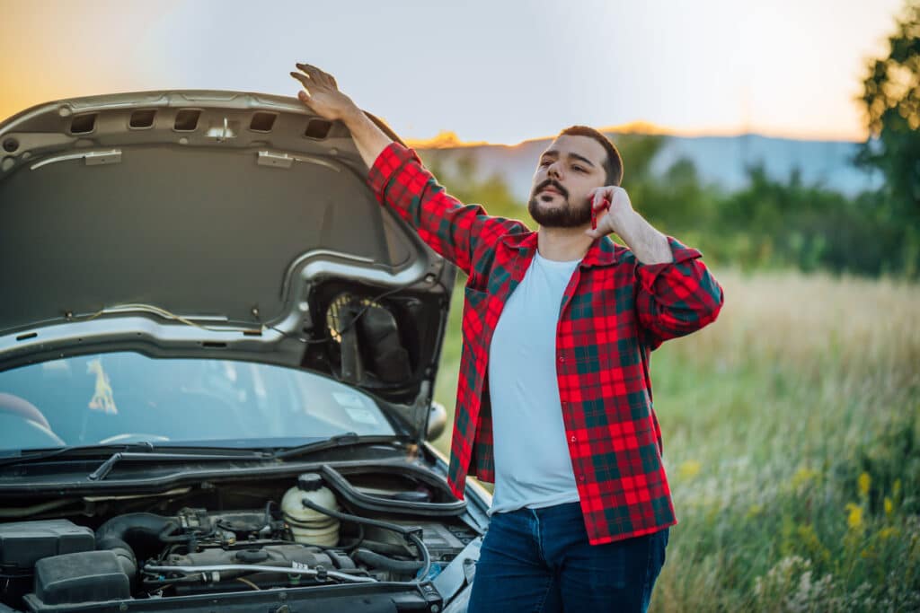 man on the phone calling for roadside assistance