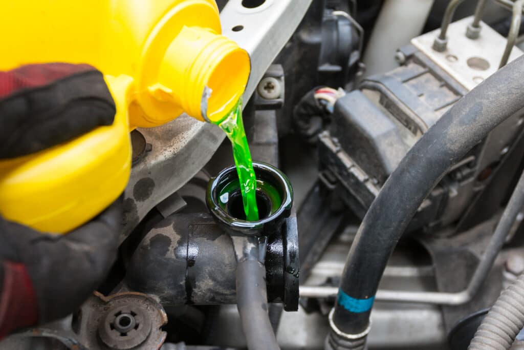 pouring engine coolant fluid