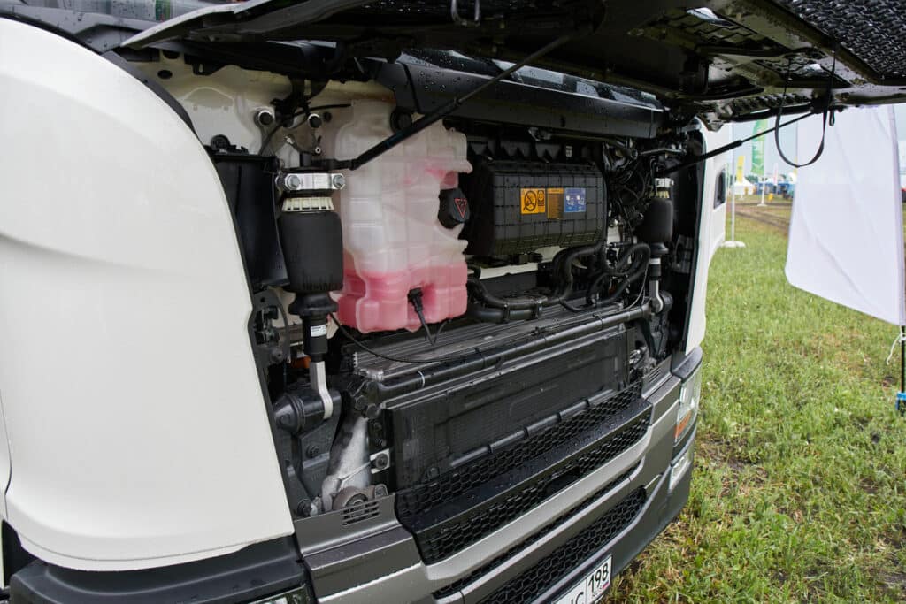 Engine compartment of Scania G410 truck. Scania G410 truck exhibited during the public event Russian Plowing Championship.